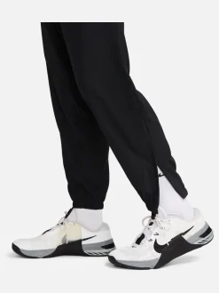 Joggingbroeken*Nike Zwart - Dri-FIT Form trainingsbroek met taps toelopende pijpen