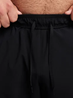 Joggingbroeken*Nike Zwart - Dri-FIT Form trainingsbroek met taps toelopende pijpen