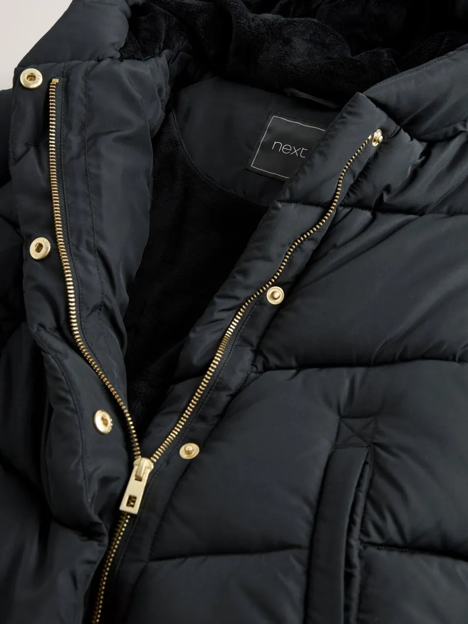 Schoolkleding|Jassen En Jacks|Next - Regenbestendige gewatteerde jas met capuchon en imitatiebontvoering (3 - 16 jr) Zwart