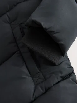 Schoolkleding|Jassen En Jacks|Next - Regenbestendige gewatteerde jas met capuchon en imitatiebontvoering (3 - 16 jr) Zwart