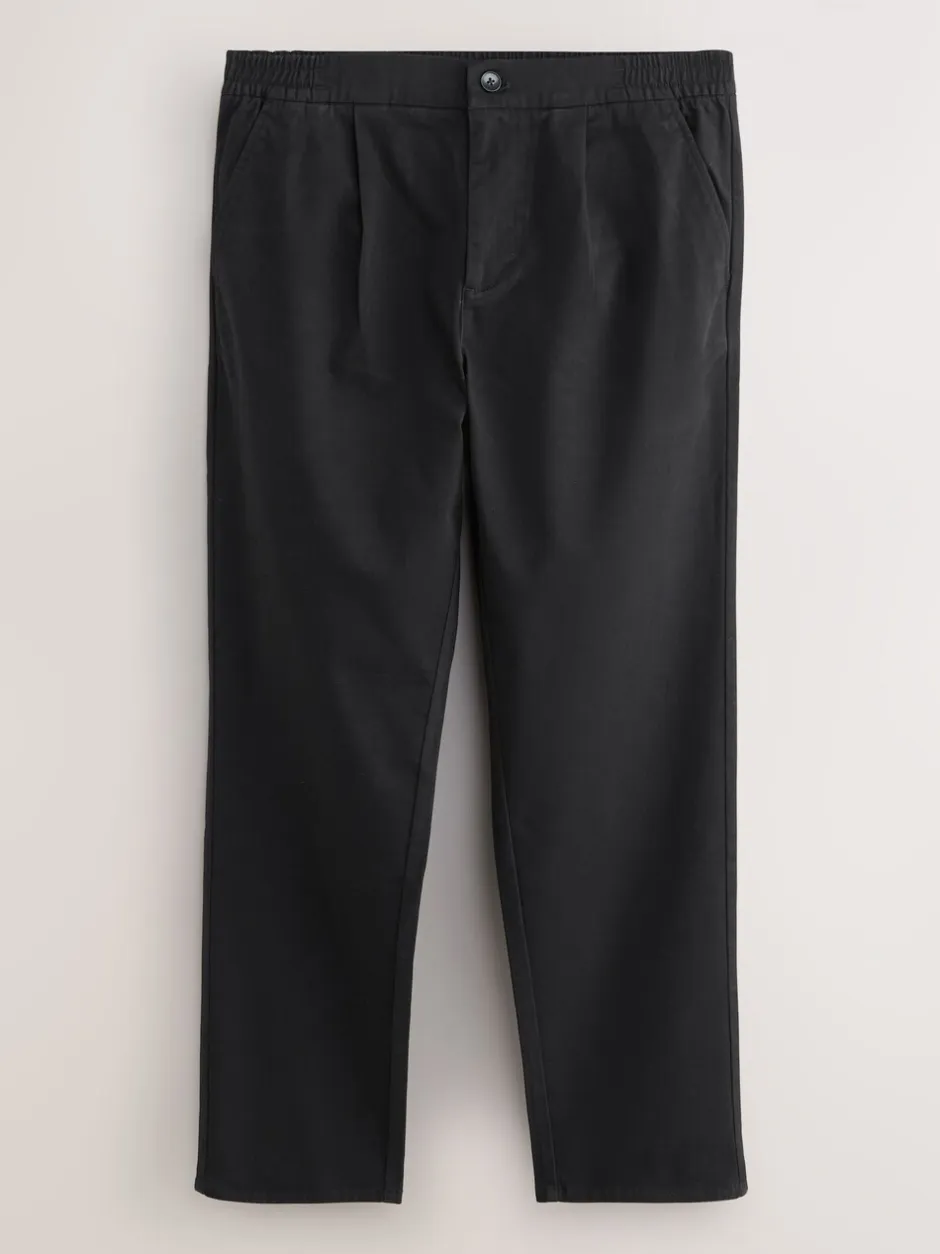 Broeken En Chino's*Next - Standaard toelopende pasvorm - Pleated Stretch Chinos Trousers With Elasticated Waist Zwart