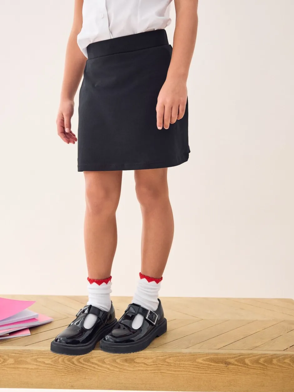 Shorts En Rokken*Next Zwart - Stretchy katoenen jersey schoolschort (3 - 16 jr)