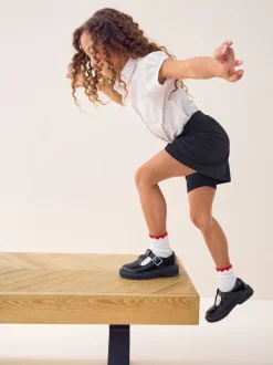 Shorts En Rokken*Next Zwart - Stretchy katoenen jersey schoolschort (3 - 16 jr)