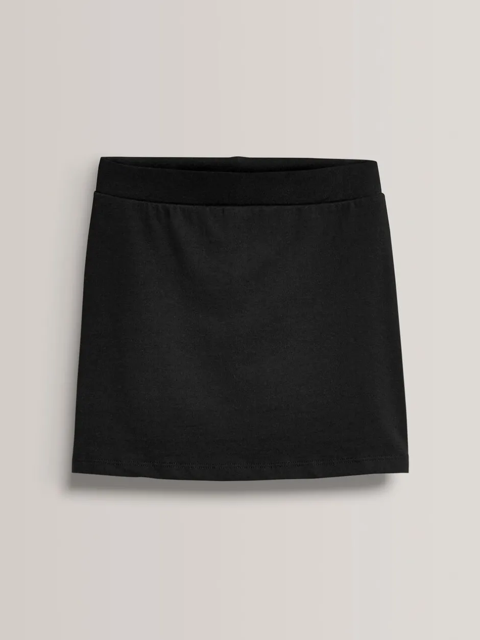 Shorts En Rokken*Next Zwart - Stretchy katoenen jersey schoolschort (3 - 16 jr)