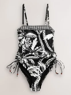 Badkleding*Next Zwart/Crème Palm - Vormgevend bandeaubadpak met buikcorrectie en afgeronde pijpen