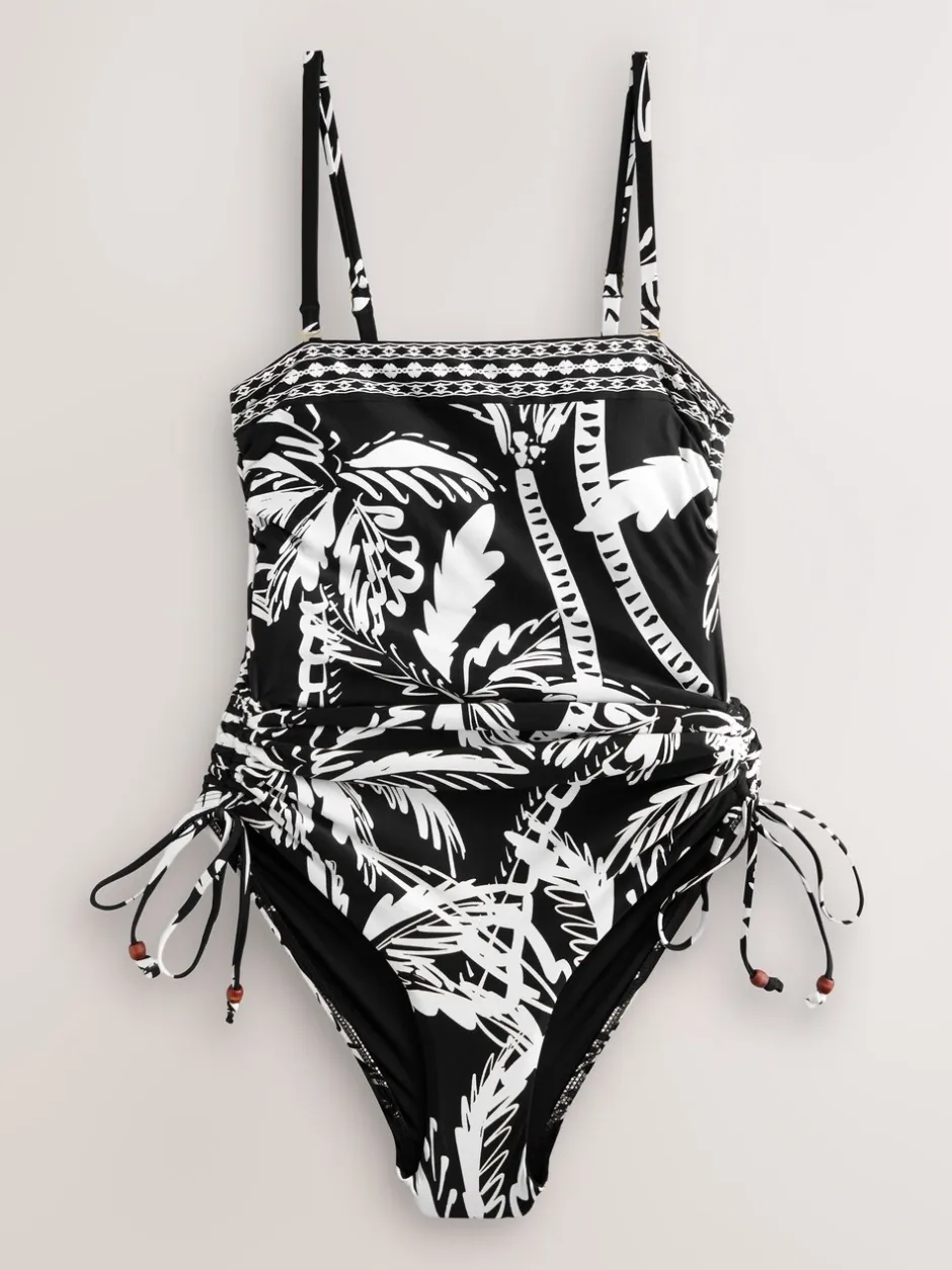 Badkleding*Next Zwart/Crème Palm - Vormgevend bandeaubadpak met buikcorrectie en afgeronde pijpen