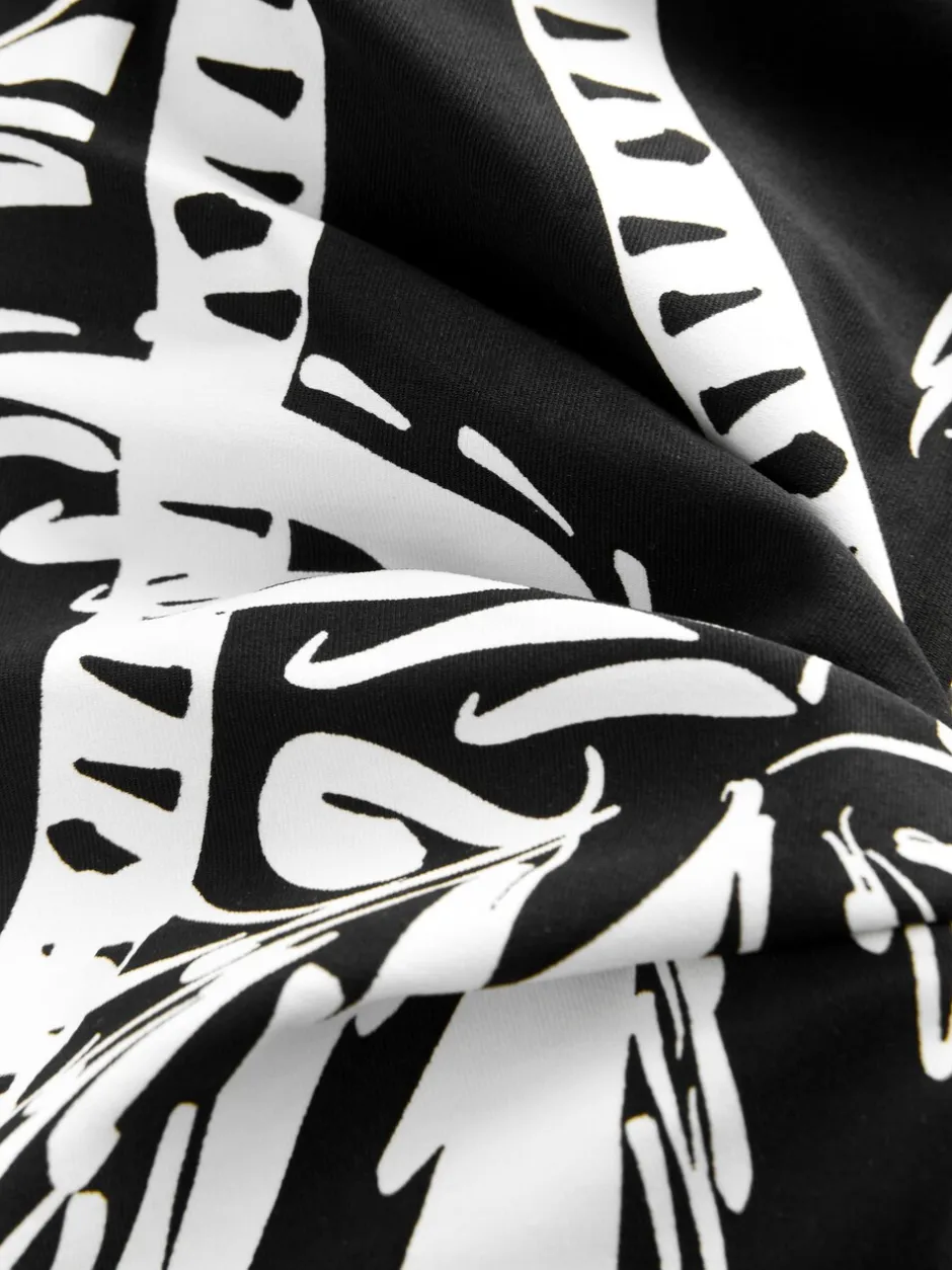 Badkleding*Next Zwart/Crème Palm - Vormgevend bandeaubadpak met buikcorrectie en afgeronde pijpen