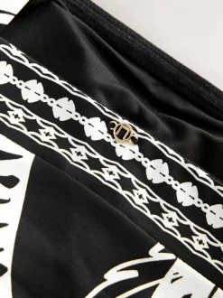 Badkleding*Next Zwart/Crème Palm - Vormgevend bandeaubadpak met buikcorrectie en afgeronde pijpen