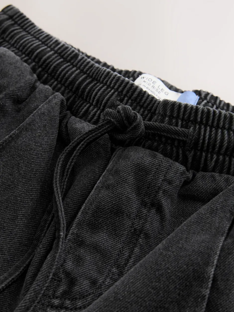 Jeans|Next - Denim joggingbroek met plooitjes en wijde pijpen Zwarte wassing