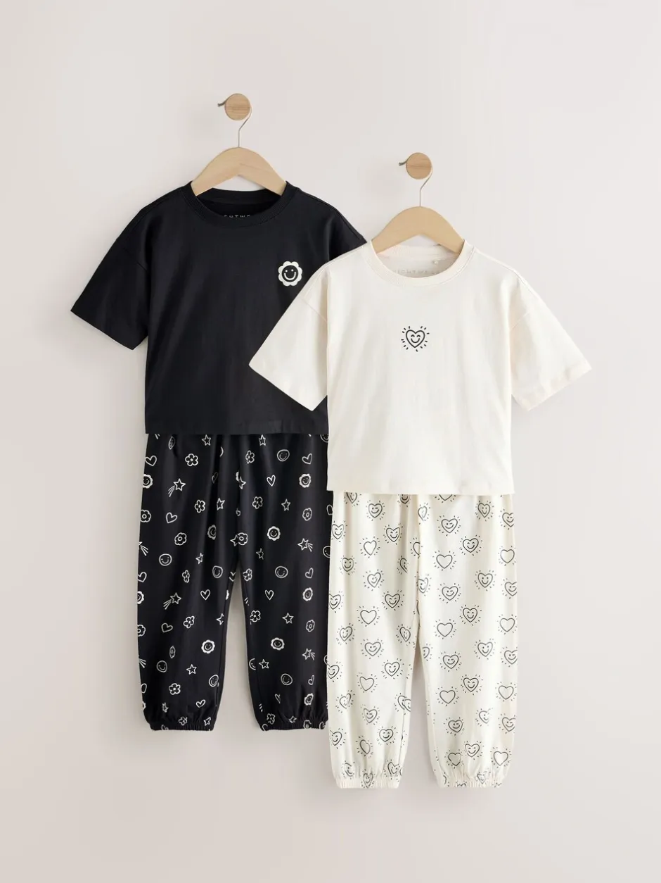 Nachtkleding En Pyjama's|Pyjama's|Next - Verpakking van 2 pyjama's met joggingbroek (3-16 jr) Zwart/ecru