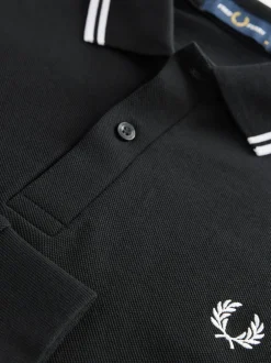 Poloshirts|Fred Perry Zwart/wit - poloshirt met tweekleurige streep op de mouw