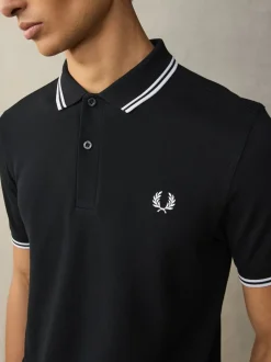 Poloshirts*Fred Perry Zwart/wit - poloshirt met gestreepte rand